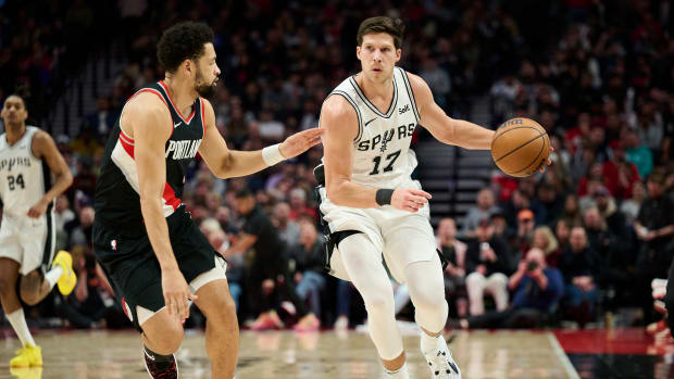 Dec 28, 2023; Portland, Oregon, USA; San Antonio Spurs forward Doug McDermott (17) dribbles the ball during the second half against Portland Trail Blazers guard Skylar Mays (5) at Moda Center.